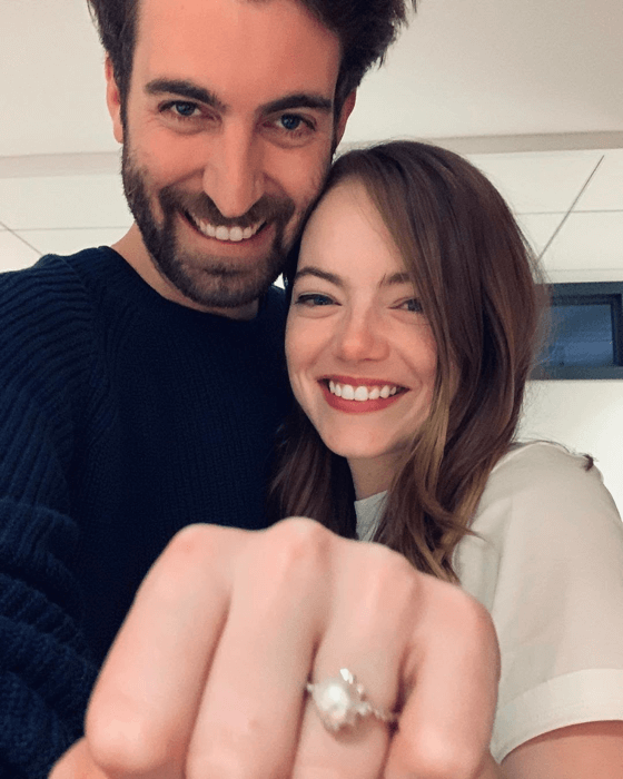 Emma Stone and Dave McCary showing the wedding ring - Pinterest